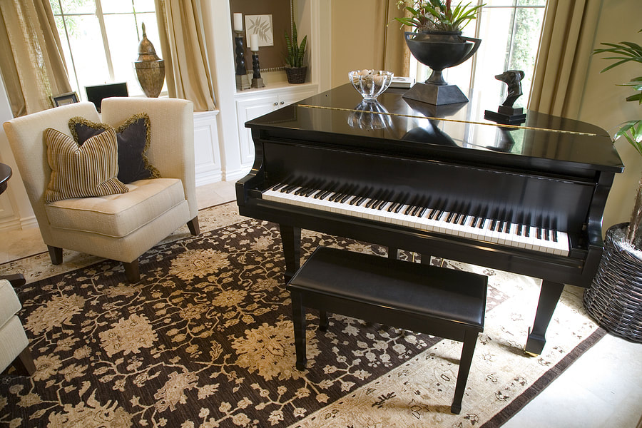 black piano top with a vase