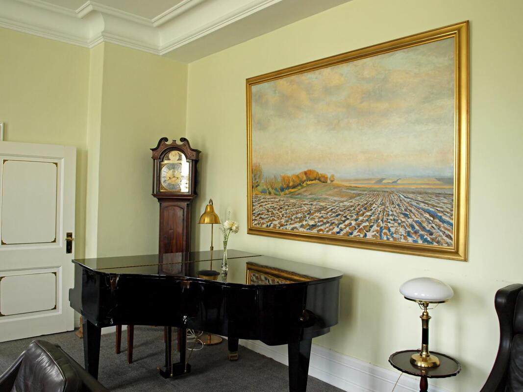 a huge painting and piano